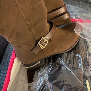 Thigh high brown rider boots